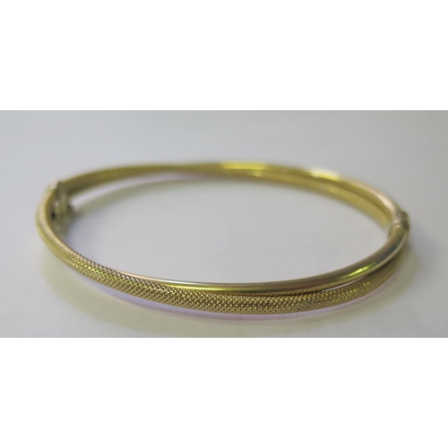 279 - A 9ct Gold Hinged Bangle,  5.2g