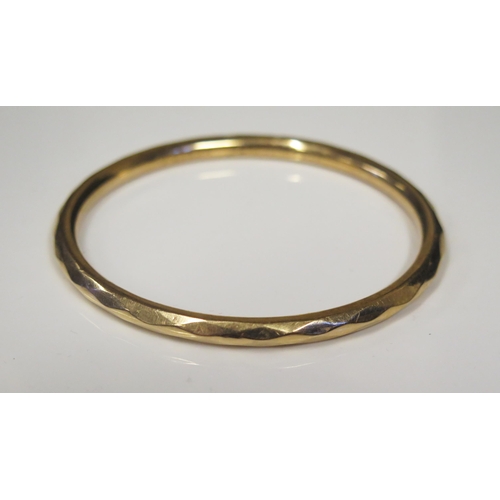 113 - A 15ct Yellow Gold Facetted Bangle, 67mm inside diam., Chester 1923, H.G.&S., 9.5g