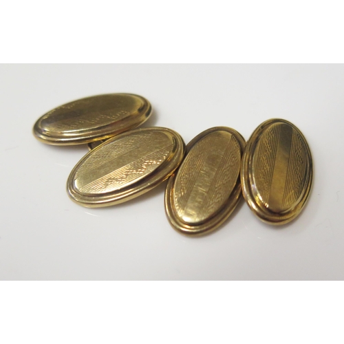 118 - A Pair of 9ct Gold Cufflinks with engine turned decoration, 3g