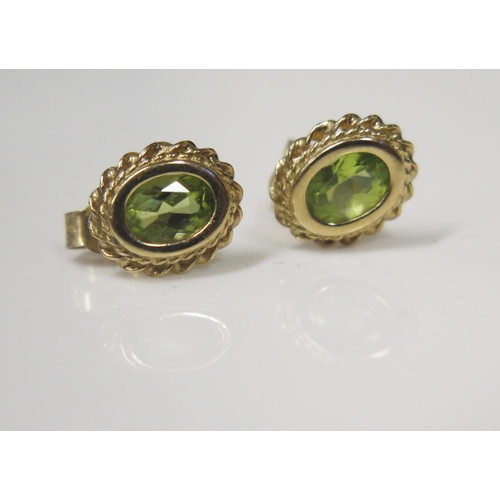 107 - A Pair of 9ct Gold and Peridot Stud Earrings, 11x9mm head, 1.5g