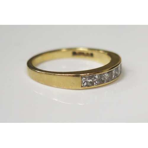 63 - An 18ct Yellow Gold and Princess Cut Seven Stone Channel Set Diamond Half Eternity Ring, .66ct, size... 