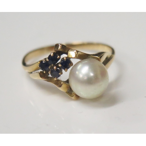 71 - A Five Stone Pearl and Sapphire Ring in an unmarked gold setting, 6.5mm pearl, size N.5, 2.5g