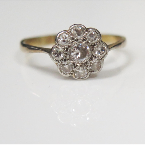 72 - An 18ct Yellow Gold and Platinum Nine Stone Diamond Cluster Ring, central diamond .12ct, head size N... 