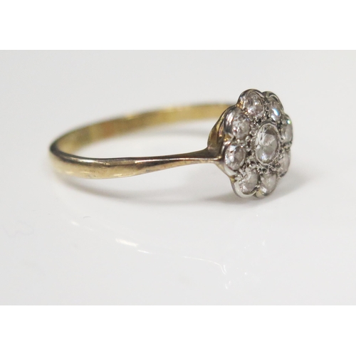 72 - An 18ct Yellow Gold and Platinum Nine Stone Diamond Cluster Ring, central diamond .12ct, head size N... 