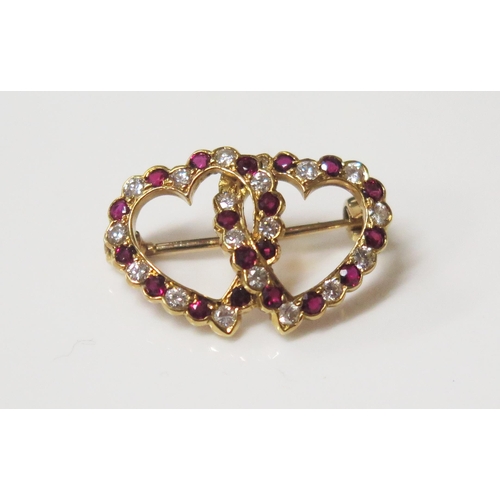 75 - An 18ct Yellow Gold Entwined Hearts Ruby and Diamond Mounted Brooch by E. Wolfe & Co. EDW. 58ct, 22m... 