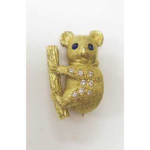 76 - An 18ct Yellow Gold, Cabochon Sapphire and Diamond Koala Bear Brooch by E. Wolfe & Co., 28mm high, 9... 