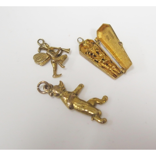 82 - A 9ct Gold Articulated Coffin Charm with hinged top revealing a skeleton (2.1g) and two unmarked gol... 
