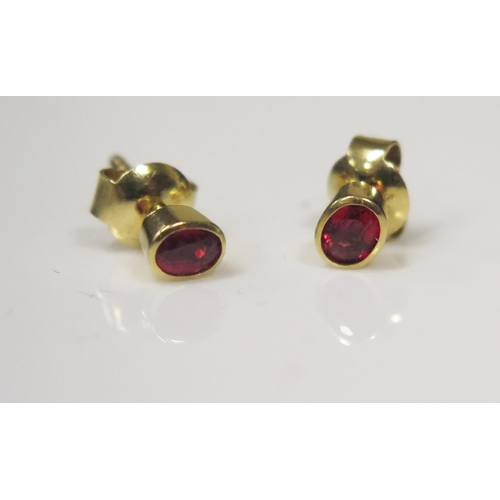 92 - A Pair of 18ct Yellow Gold and Ruby Stud Earrings, 1.5g