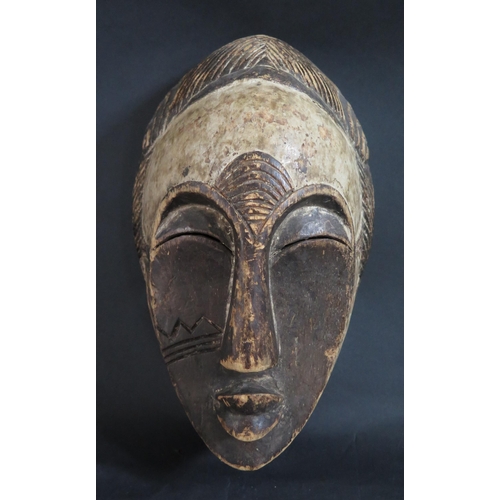 440 - A West African Gabon Carved and Painted Light Wood Spirit Mask, 31cm