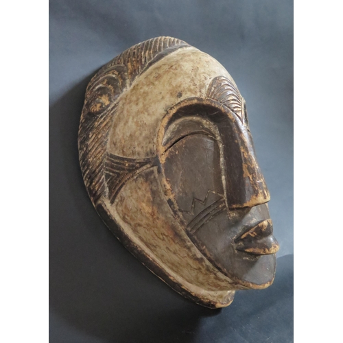 440 - A West African Gabon Carved and Painted Light Wood Spirit Mask, 31cm