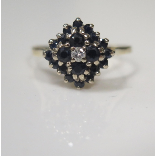 1838 - An 18ct Gold, Sapphire and Diamond Cluster Ring, London 1969, 13mm head, size S.5, 4.4g
