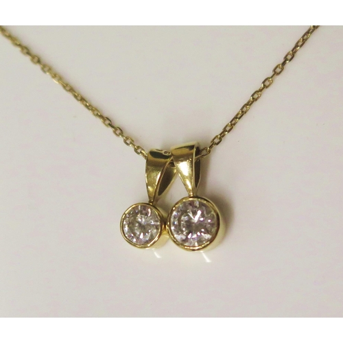 1850 - A Graduated Pair of 18ct Yellow Gold and Solitaire Diamond Pendants in rub over settings (stones 0.4... 