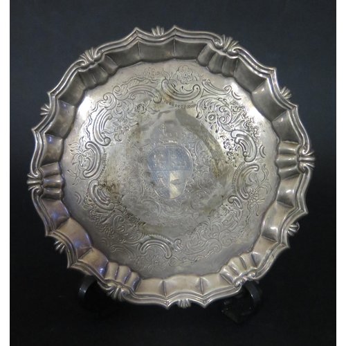 1280 - A George II Silver Pie Crust Salver with chased foliate scroll decoration bordering the Marder famil... 