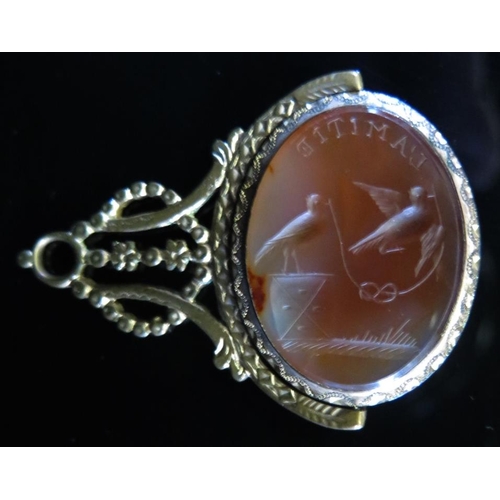 1513 - A 19th Century Agate Swivel Fob Seal engraved with L'AMITIE' and a two birds holding a knotted lengt... 