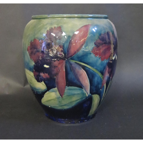 164 - A William Moorcroft Iris Decorated Vase, 23.5cm, impressed marks and signature to the base. Small ch... 