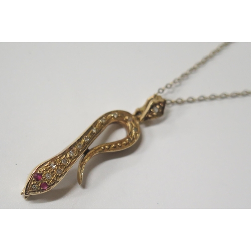 1667 - A 9ct Gold, Diamond and Ruby Snake Pendant (38mm drop) on an 18