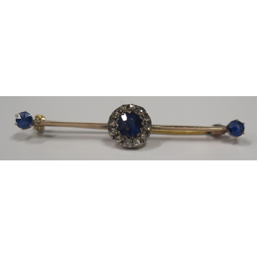 1675 - A Victorian Sapphire and Diamond Brooch in an unmarked gold setting, central stone 5mm, 47mm long