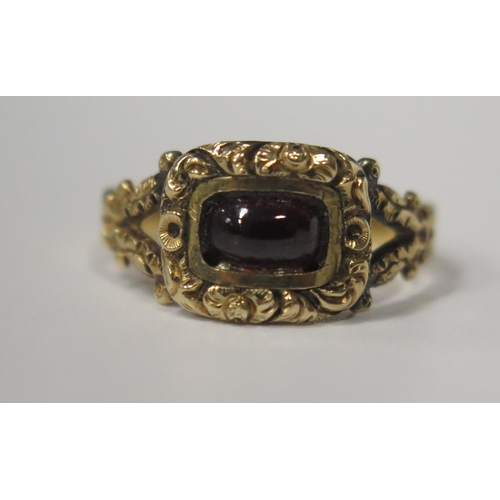 1683 - A Georgian Cabochon Garnet Ring with chased foliate decoration, size L.5, 2.4g