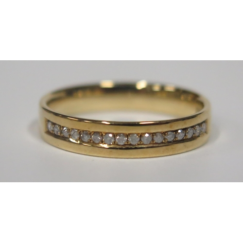 1700 - A 9ct Gold and Channel Set Diamond Half Eternity Ring, size N.5, 2.6g