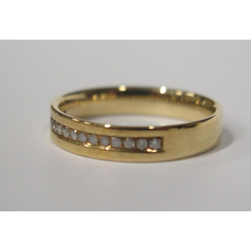 1700 - A 9ct Gold and Channel Set Diamond Half Eternity Ring, size N.5, 2.6g