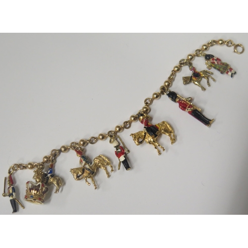 1704 - A 9ct Gold and Enamel Royalist Charm Bracelet including The Queen, Guards and Crown, 39.5g