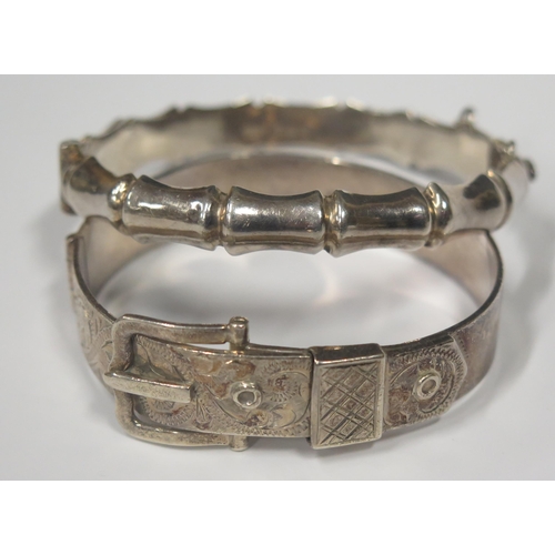 1712 - A Hallmarked Sterling Silver Hinged Buckle Bangle and one other hallmarked silver hinged bangle, 48.... 