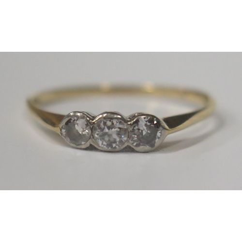 1714 - A Three Stone Diamond Ring in an 18ct? Gold Setting, marks rubbed, size L, 1.4g, boxed