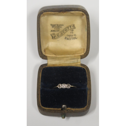 1714 - A Three Stone Diamond Ring in an 18ct? Gold Setting, marks rubbed, size L, 1.4g, boxed