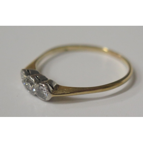 1714 - A Three Stone Diamond Ring in an 18ct? Gold Setting, marks rubbed, size L, 1.4g, boxed