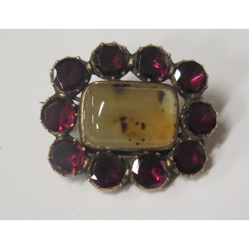 1717 - A Georgian Foil Backed Garnet and Agate Brooch in an unmarked yellow gold setting, 23x19mm, 4.3g