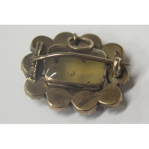 1717 - A Georgian Foil Backed Garnet and Agate Brooch in an unmarked yellow gold setting, 23x19mm, 4.3g