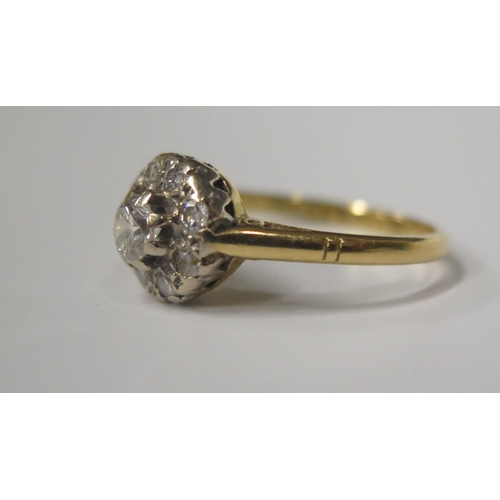 1727 - An 18ct Yellow Gold and Diamond Cluster Ring, central stone 4.5mm, 9.5mm spread, size N, 3.4g