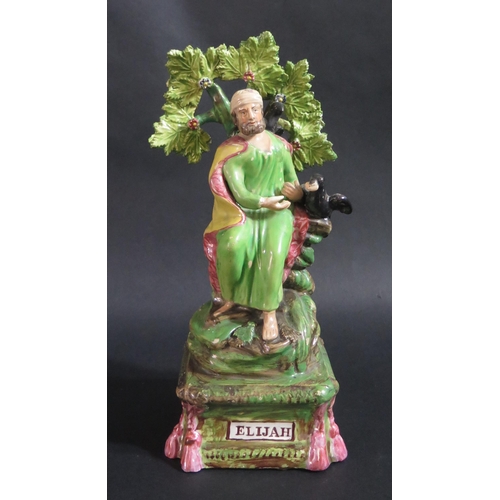 176 - An Early 19th Century Staffordshire Pottery Figure of ELIJAH with bocage, 29.5cm