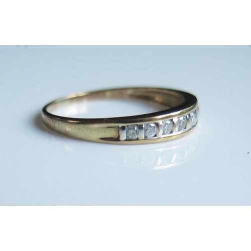 1785 - A 9ct Yellow Gold and Diamond Eight Stone Ring, size S.5, 1.9g