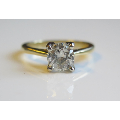 1796 - A 1.45ct Diamond Solitaire Engagement Ring in an 18ct yellow gold setting, size O, 4.9g