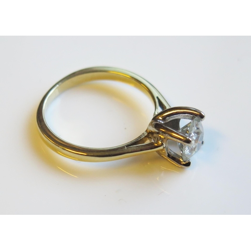 1796 - A 1.45ct Diamond Solitaire Engagement Ring in an 18ct yellow gold setting, size O, 4.9g