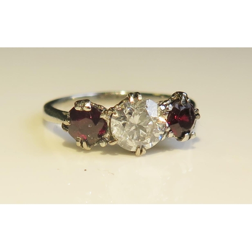 1803 - A Platinum, Ruby and Diamond Three Stone Ring, size H.5, 3g. EDW .8ct, rubies 4.5 and 4mm