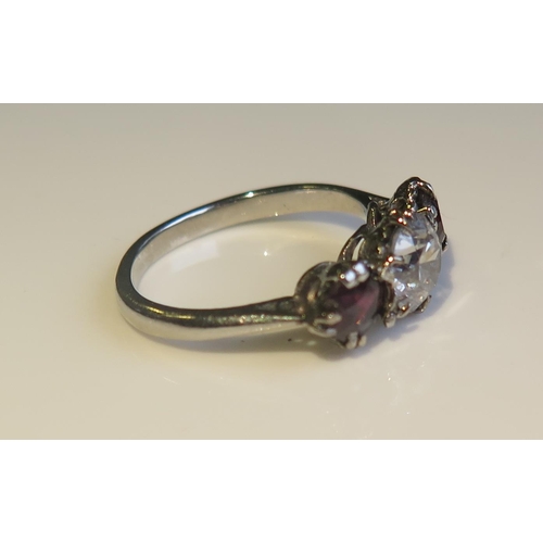 1803 - A Platinum, Ruby and Diamond Three Stone Ring, size H.5, 3g. EDW .8ct, rubies 4.5 and 4mm