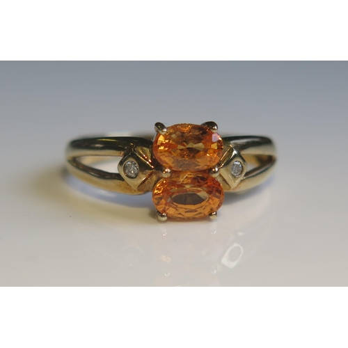 1807 - A 9ct Gold, Orange Sapphire and Diamond Ring, size O, 2.7g