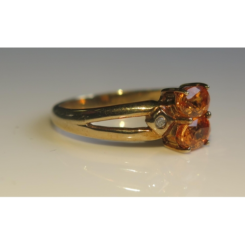 1807 - A 9ct Gold, Orange Sapphire and Diamond Ring, size O, 2.7g