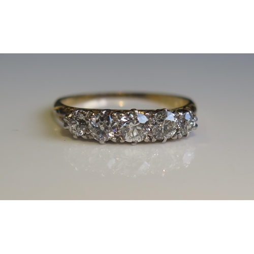 1809 - A Victorian Five Stone Diamond Ring in an unmarked gold setting, traces of engraved dedication to in... 