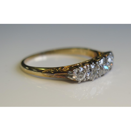 1809 - A Victorian Five Stone Diamond Ring in an unmarked gold setting, traces of engraved dedication to in... 