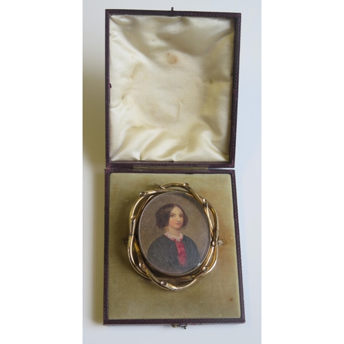 1814 - A Charming Boxed 19th Century Gold Mounted Memorial Brooch decorated with a half length portrait of ... 