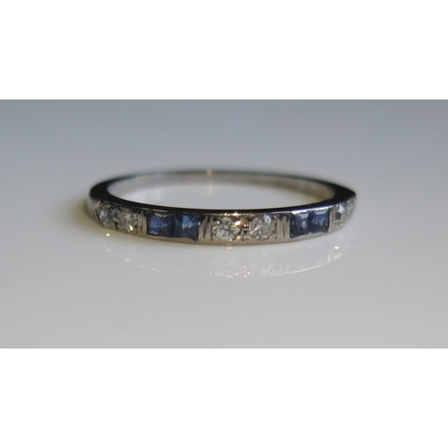 1815 - A Sapphire and Diamond Half Eternity Ring in a precious white metal setting, size P, 2.1g