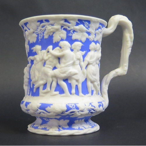 182 - A 19th Century Salt Glazed Mug decorated with a Bacchanalian scene in high relief, base marked 'THE ... 