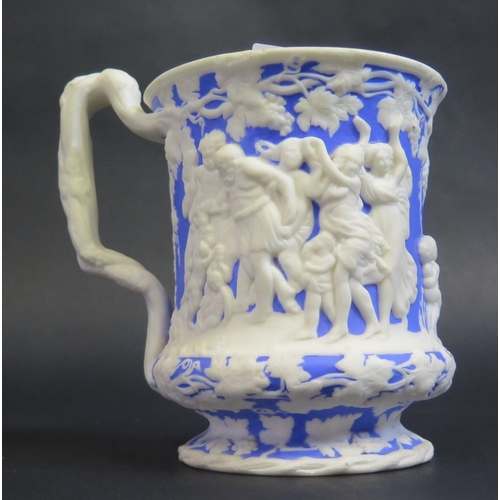 182 - A 19th Century Salt Glazed Mug decorated with a Bacchanalian scene in high relief, base marked 'THE ... 