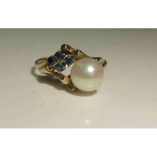 1855 - A Five Stone Pearl and Sapphire Ring in an unmarked gold setting, 6.5mm pearl, size N.5, 2.5g