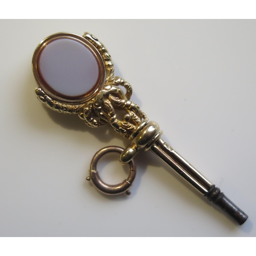 1866 - A Victorian 15ct Gold Watch Key with agate and bloodstone spinning finial, 50mm long, 9.6g