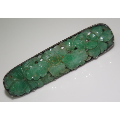 1887 - A Chinese Carved and Pierced Jadeite and Silver Mounted Brooch, 51mm wide, 8.4g
