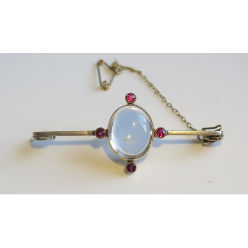 1896 - A Ruby and Crystal Brooch in an unmarked gold setting, 56mm, 6.2g. Pin missing